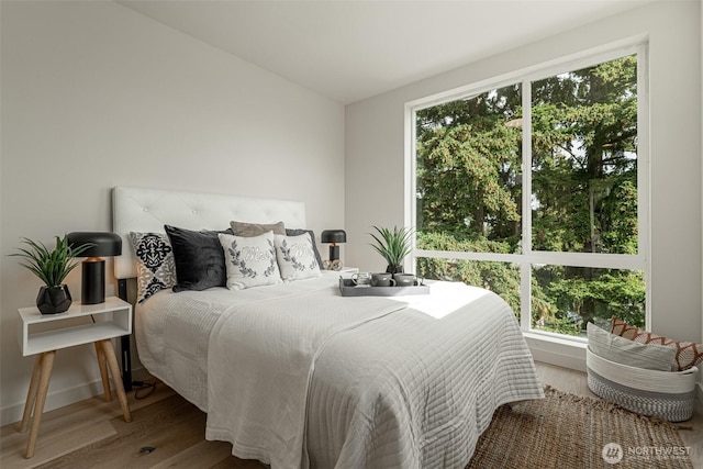 bedroom featuring wood finished floors