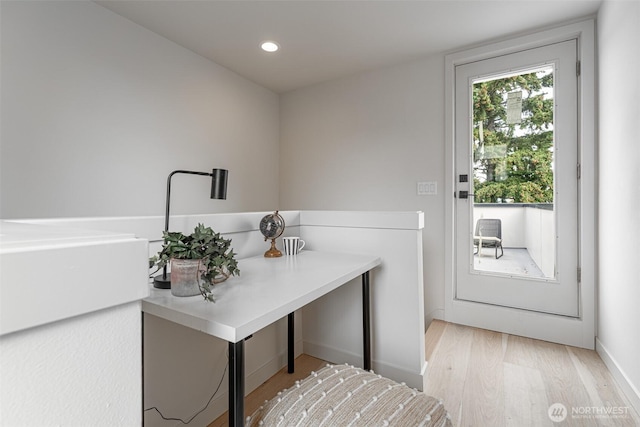 laundry area with recessed lighting and light wood-style flooring