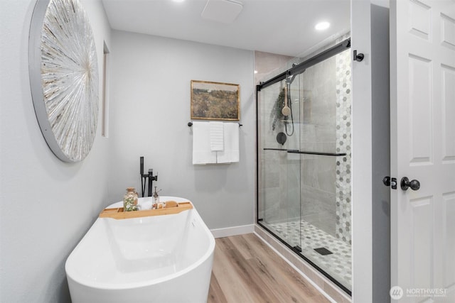 full bathroom with a shower stall, recessed lighting, wood finished floors, and baseboards