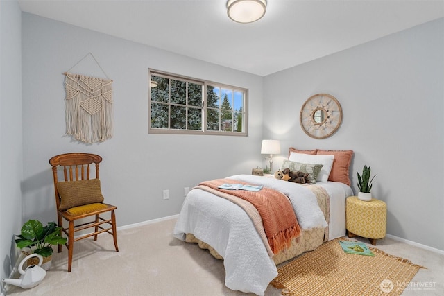 carpeted bedroom featuring baseboards