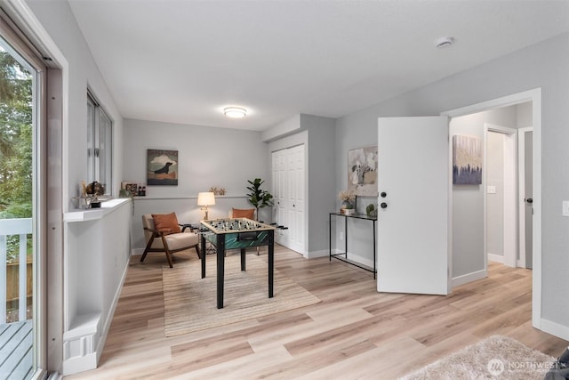 office with plenty of natural light, baseboards, and light wood-style floors