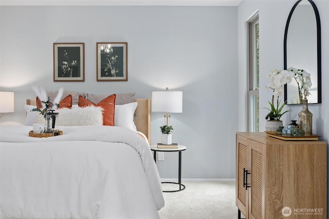 bedroom featuring baseboards and carpet floors