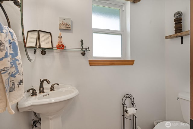 bathroom with a sink and toilet