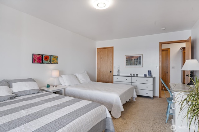 bedroom featuring light carpet