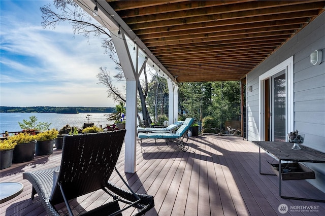 wooden deck featuring a water view