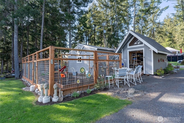 exterior space with a garage and a lawn