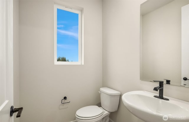 bathroom with a sink and toilet