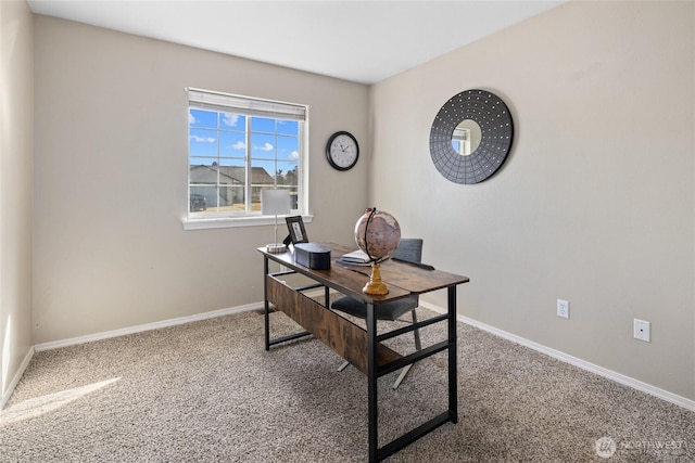 carpeted office space with baseboards