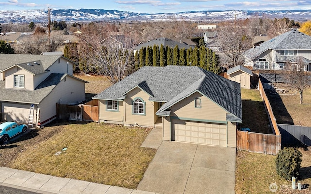 birds eye view of property with a residential view and a mountain view