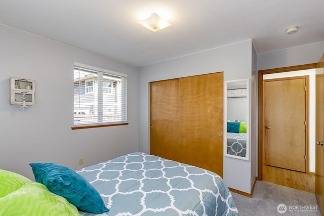 carpeted bedroom featuring a closet