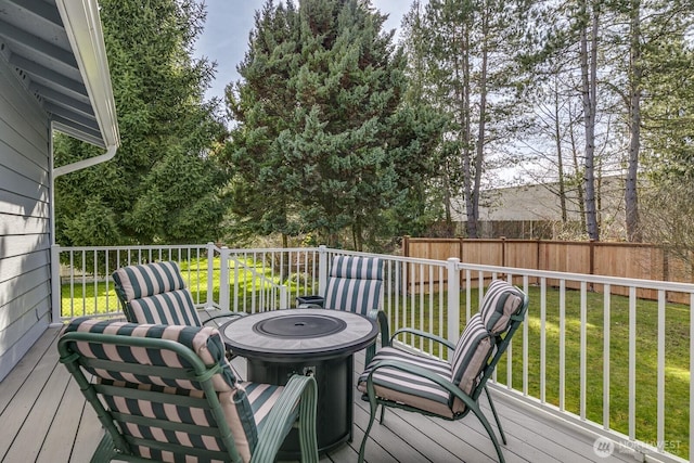 deck featuring a yard and fence