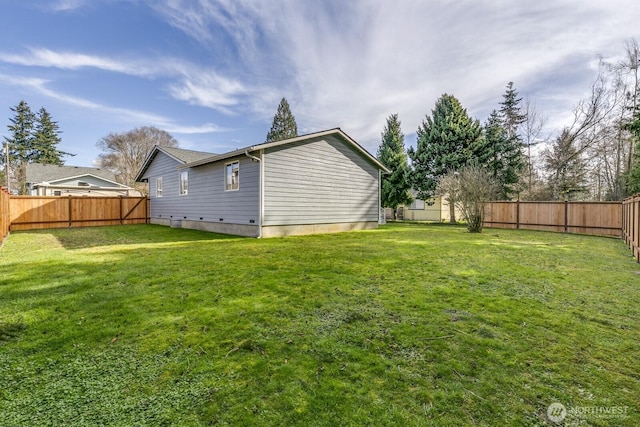 view of yard featuring a fenced backyard