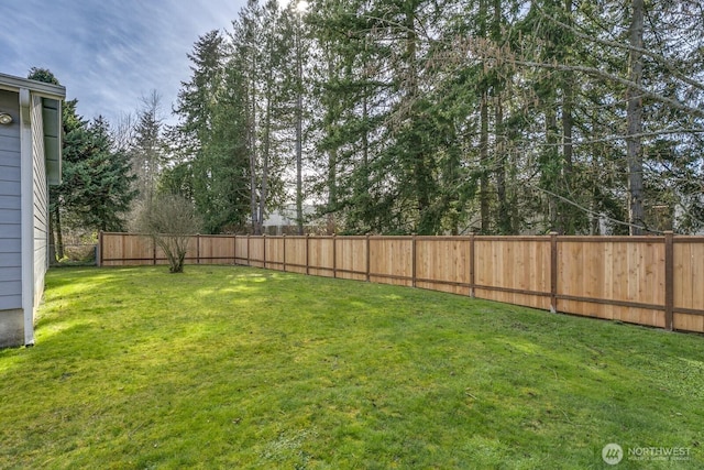 view of yard featuring a fenced backyard