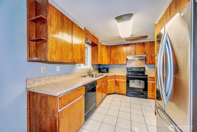 kitchen with brown cabinets, under cabinet range hood, black appliances, open shelves, and a sink