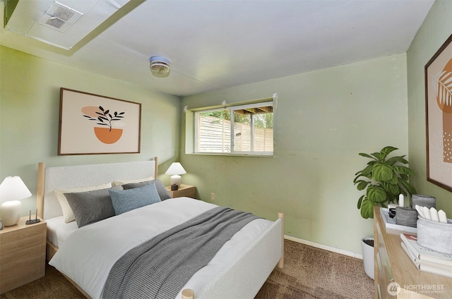 carpeted bedroom featuring visible vents and baseboards