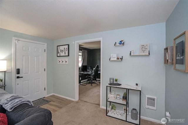 living area with carpet and baseboards