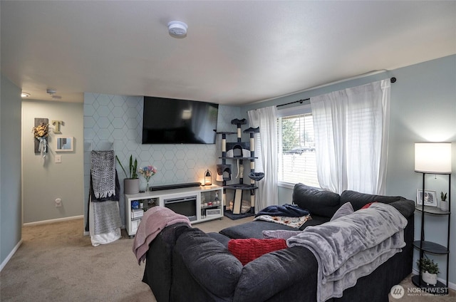 10103 Kline St SW, Lakewood, WA 98499 - living room with an accent wall, baseboards, a fireplace, and light colored carpet
