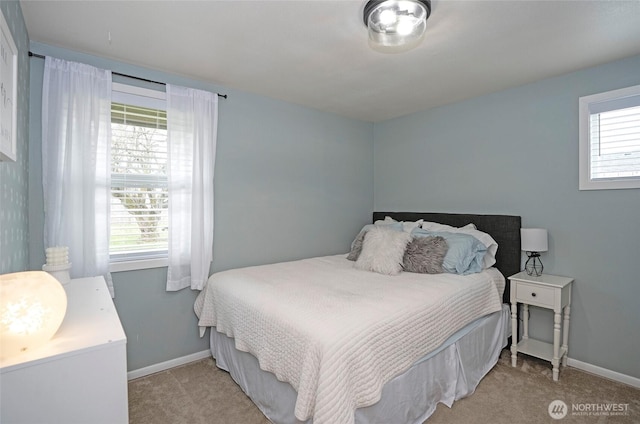 10103 Kline St SW, Lakewood, WA 98499 - bedroom with light carpet, baseboards, and multiple windows