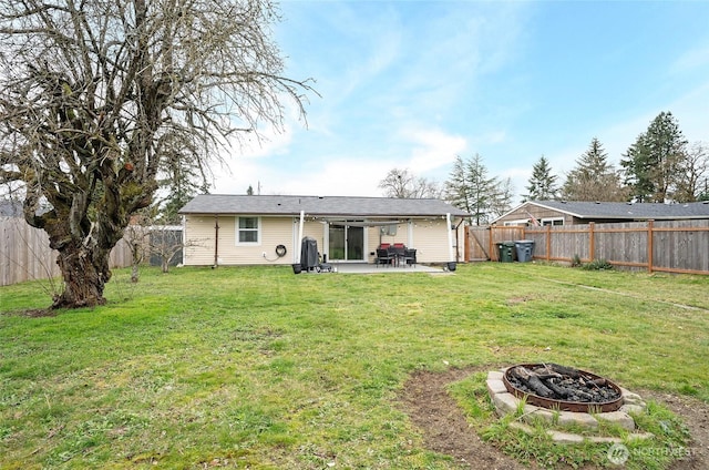 10103 Kline St SW, Lakewood, WA 98499 - rear view of property with an outdoor fire pit, a fenced backyard, a lawn, and a patio