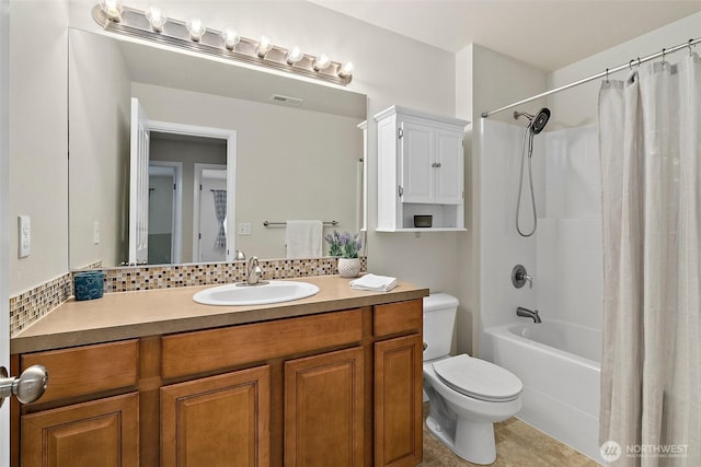 full bathroom featuring toilet, visible vents, vanity, backsplash, and shower / bath combo with shower curtain