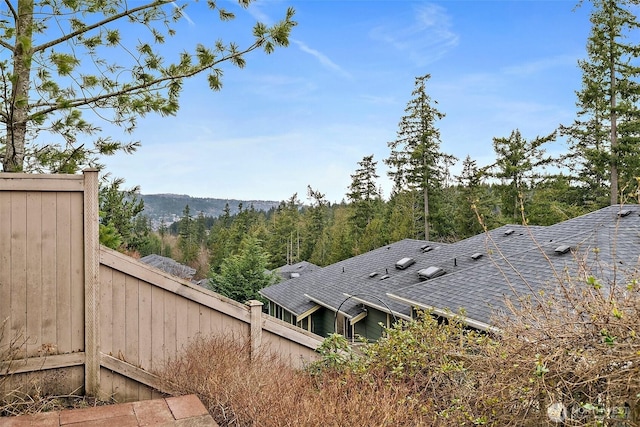 exterior space with a wooded view