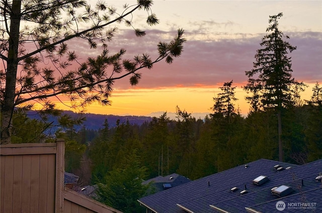 view of mountain feature featuring a forest view