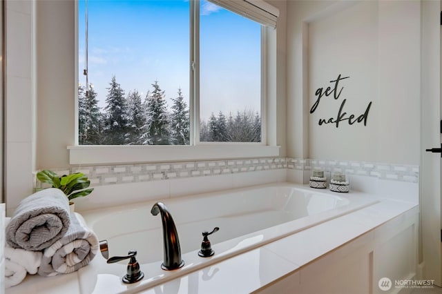 bathroom featuring a garden tub