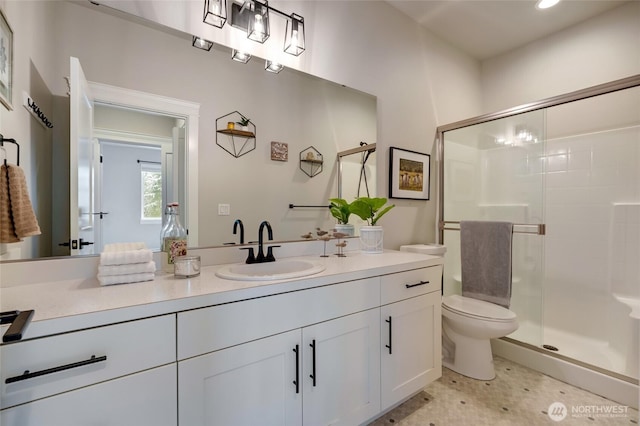 full bathroom with a stall shower, recessed lighting, toilet, and vanity
