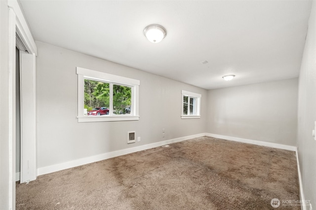 unfurnished bedroom with a closet, baseboards, visible vents, and carpet flooring