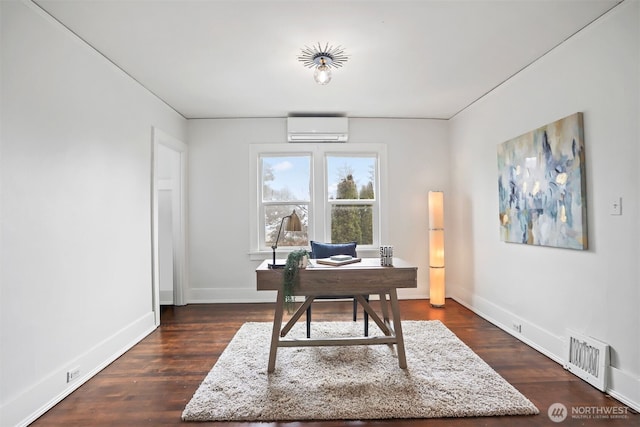 home office featuring dark wood-type flooring, an AC wall unit, visible vents, and baseboards