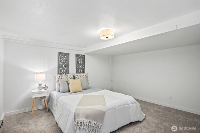 bedroom featuring carpet flooring and baseboards