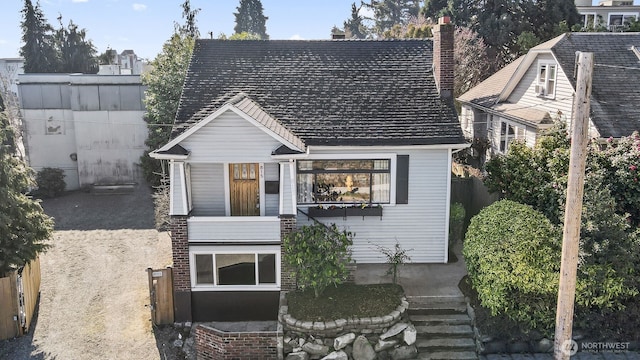 view of front of property featuring fence