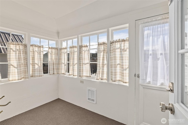 unfurnished sunroom with visible vents