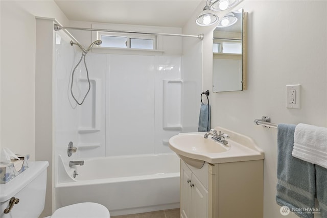 bathroom featuring bathtub / shower combination, vanity, and toilet