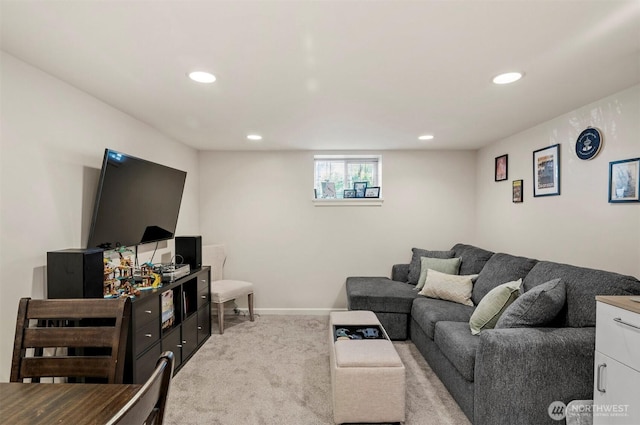 living area featuring recessed lighting, baseboards, and light colored carpet