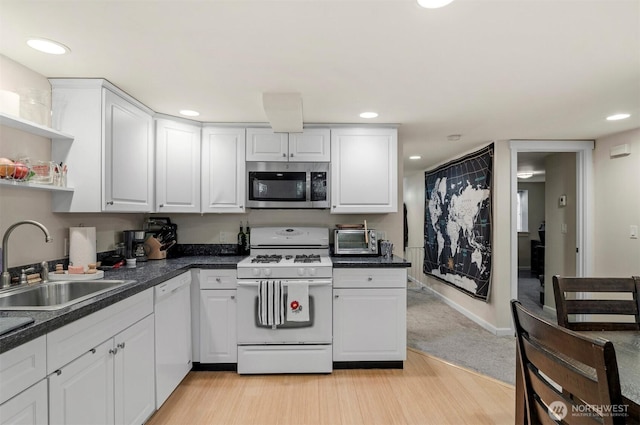 kitchen featuring open shelves, white appliances, a sink, and white cabinets