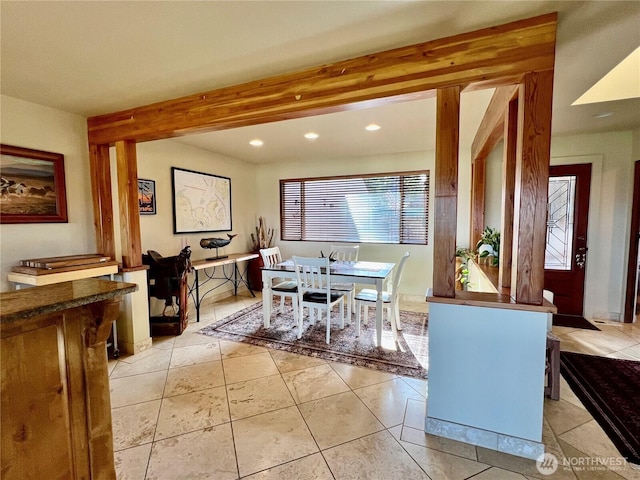 dining space with light tile patterned floors, beam ceiling, and recessed lighting