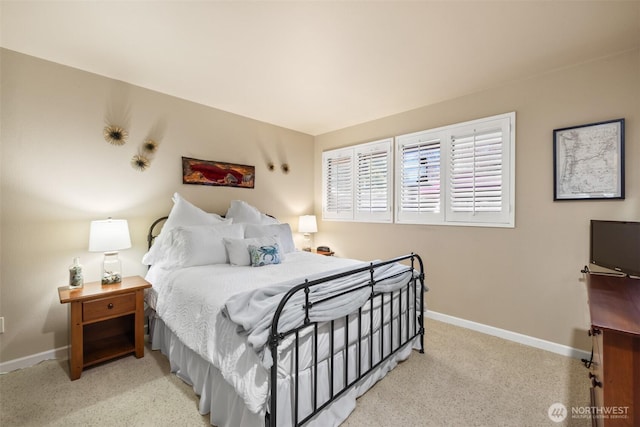 bedroom featuring carpet flooring and baseboards