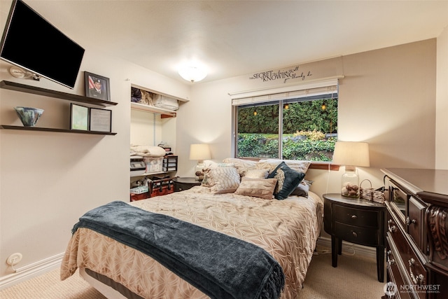 bedroom featuring carpet flooring and baseboards