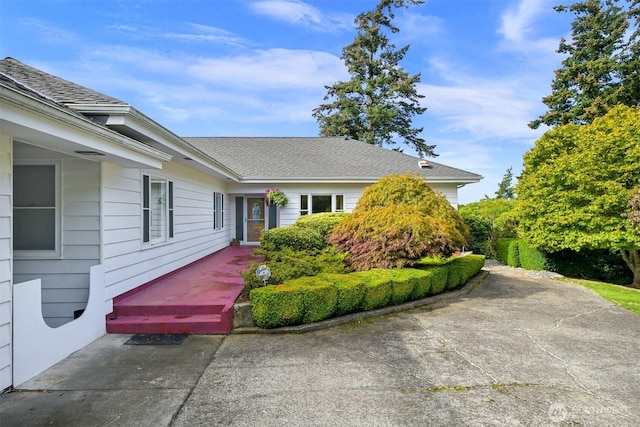 view of front of property with roof with shingles