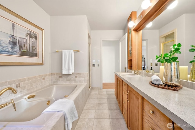 bathroom featuring a whirlpool tub, a stall shower, tile patterned flooring, and vanity