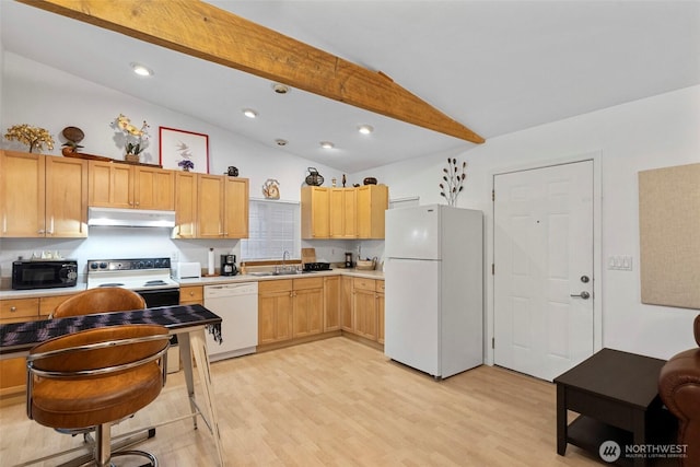 kitchen featuring white appliances, a sink, under cabinet range hood, and lofted ceiling with beams