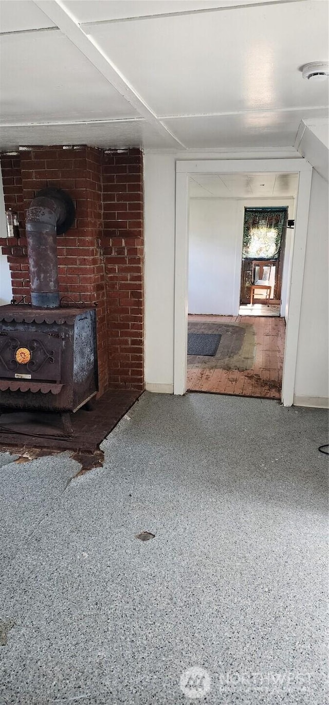 12 Seal Slough Dr, Rosburg, WA 98643 - unfurnished living room with a wood stove and speckled floor