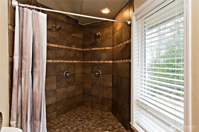 bathroom featuring a shower stall