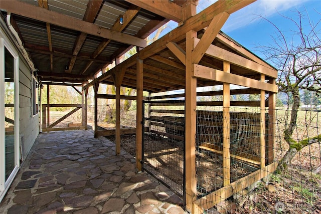 view of patio / terrace with an outbuilding