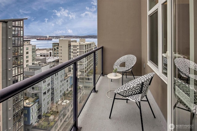 balcony featuring a water view