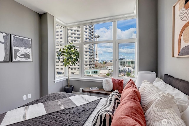 bedroom featuring a view of city