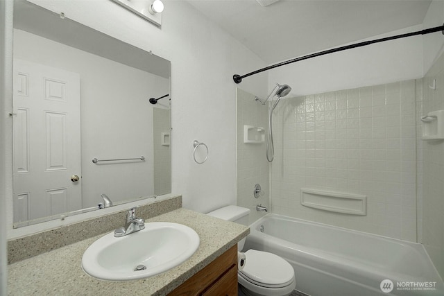 bathroom with toilet, tub / shower combination, and vanity