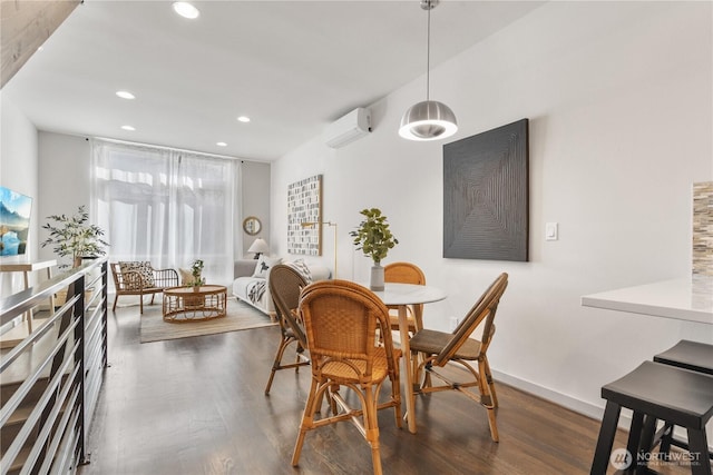 dining area featuring dark wood-style floors, recessed lighting, a wall mounted air conditioner, and baseboards