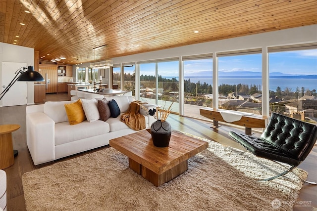 living room with wood ceiling, wood finished floors, and recessed lighting